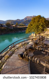 Green And Clean Ganges River At Sunset In Rishikesh, Uttarakhand, India.