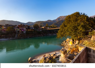 Green And Clean Ganges River At Sunset In Rishikesh, Uttarakhand, India.