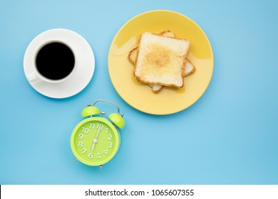 Green Clock At Six O'clock Time To Breakfast With Hot Black Coffee And Toast Yellow Dish Pastel Style Copyspace Flatlay 