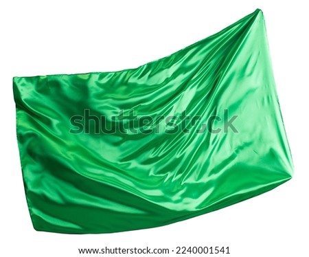 Green cloth flutters in the wind. Isolated on white background