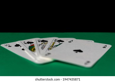 green cloth and playing cards