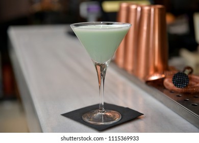 Green Cocktail With White Cocoa Cream And Menthol Cream