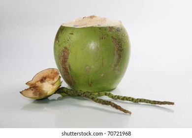 Green Coconut With Straw On Isolated Background.