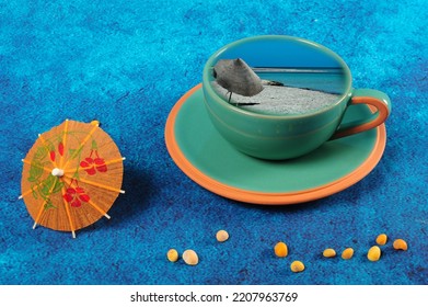 Green  Coffee Cup With Beach Scene From Tunisia. Drink Umbrella And Tiny Yellow Sesnail Shells.