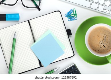 Green Coffee Cup And Office Supplies. View From Above. Closeup