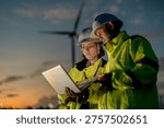 Green collar workforce using advanced tech to manage sustainable wind power. Visionary engineers committed to global ESG goals and carbon neutrality.
