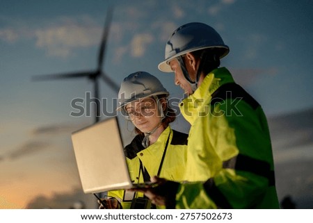 Green collar workforce using advanced tech to manage sustainable wind power. Visionary engineers committed to global ESG goals and carbon neutrality.