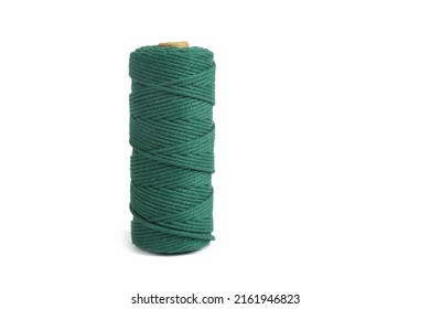 Green Color Skein Single Strand Cotton Cord Rope For Macrame On White. Use For DIY Handcraft. Closeup Textile Bobbin Reel