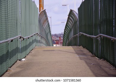 Green color steel link fence of enclosed pedestrian passage - Powered by Shutterstock