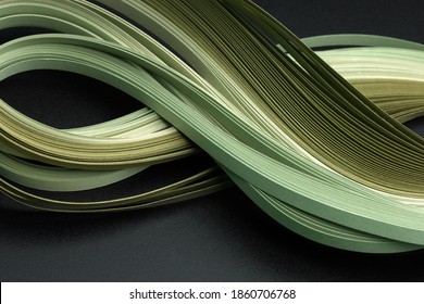 Green Color Strip Wave Paper. Abstract Texture Black Background.