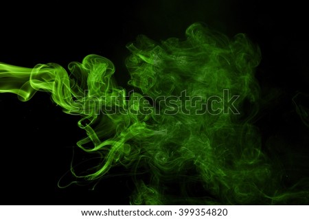 Green colored smoke on a black background, abstract cloud.  Abstract green lighting, 