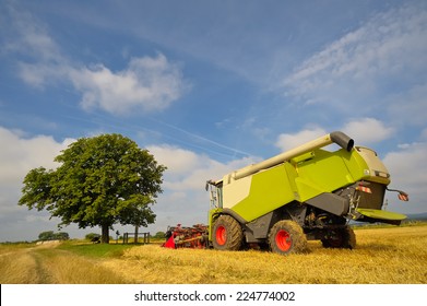 Green Combine Harvester Harvesting