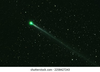 Green comet in dark space. Elements of this image furnished by NASA. High quality photo - Shutterstock ID 2258427243