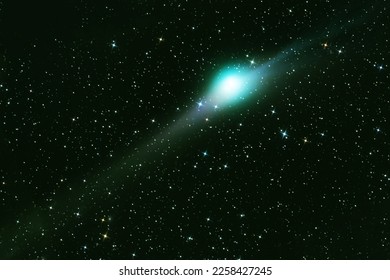 Green comet in dark space. Elements of this image furnished by NASA. High quality photo - Shutterstock ID 2258427245
