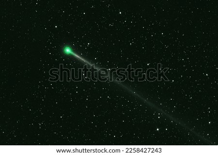 Green comet in dark space. Elements of this image furnished by NASA. High quality photo