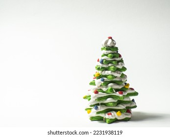 Green cookie christmas tree made by star cookie cutter on white background. New Year Christmas card. Matcha Green Tea Gingerbread Christmas tree Cookies covered with white chocolate. Copy space. - Powered by Shutterstock