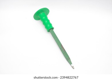 Green corroded chisel on white background. A chisel is a carpentry tool in the form of an iron blade that is sharp at the end to make holes or carve hard objects such as wood, stone or metal. - Shutterstock ID 2394822767