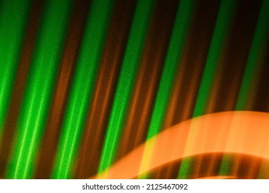 Green Corrugated Metal Background With Orange Light Trail. St Patrick's Day Abstract Backdrop.