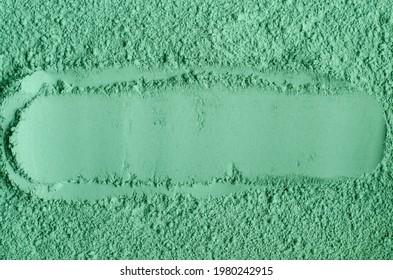 Green cosmetic clay powder (kelp facial mask, spirulina body wrap) texture close up, selective focus. Abstract background with place for text. 