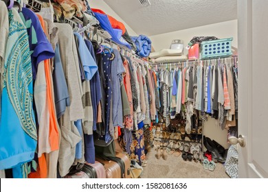 Green Cove Springs, Florida / USA - December 7 2019: Womens Walk-in Closet With Clothes And Shoes