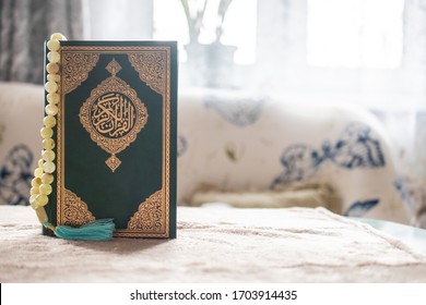 Green covered Muslim Holy book Qu'ran in Arabic 
