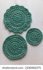 Green crochet doilies. This photo has been taken in Prague, 2023