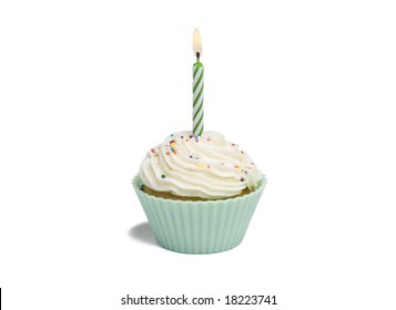 Green Cupcake With Candle On White Background