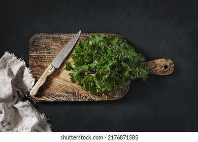 Green Curly Kale Plant Set, On Old Dark Wooden Table Background