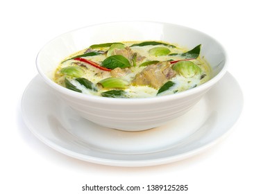 Green curry chicken with coconut milk (Kaeng keiaw waan) Thaifood curry style e in white bowl side view isolated on white background