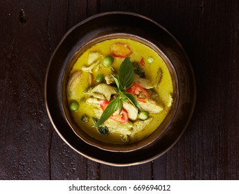 Green curry on wooden background, Thai food