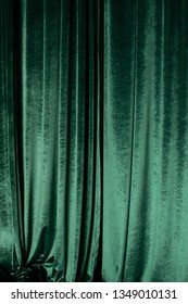 Green Curtain Of Luxurious Velvet On The Theater Stage. Copy Space. The Concept Of Music And Theatrical Art.