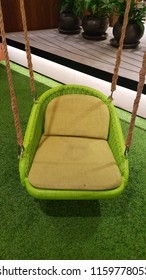 Green Cushion Swing With Rope Isolated