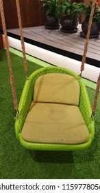 Green Cushion Swing With Rope Isolated