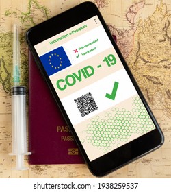 Green Digital Vaccination Passports With EU Logo On Map With Passport And Vaccine It Self, Covid-19 Concept, Selective Focus.