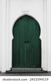 Green door in Morocco entrance to synagogue.