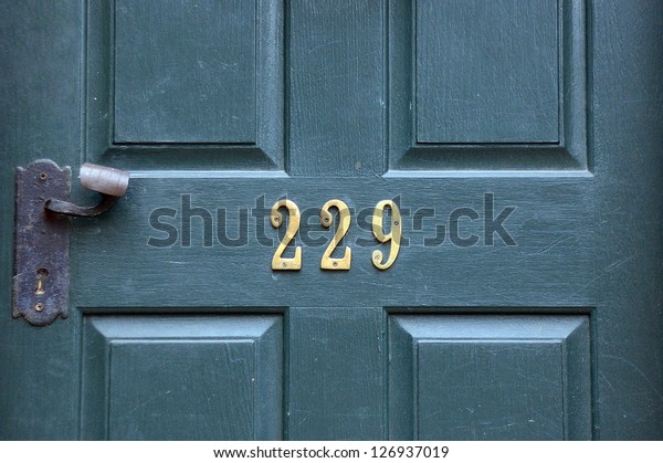 Green door with number\
229