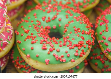 Green Doughnut With Bright Sprinkles Round.