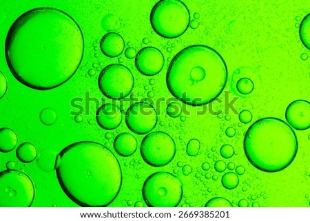 Green drink texture and bubbles macro close up,Water wave, close up of vibrant green liquid with bubbles, capturing dynamic movement and freshness. Perfect for backgrounds, beverages.