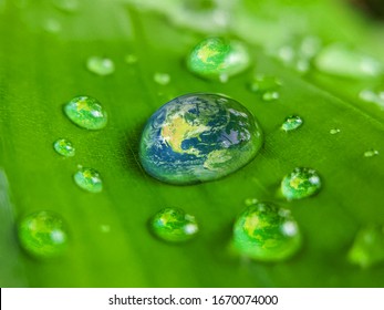 Green Earth Water Drop.Earth Day Concept- World Or Earth On Fresh Water Drop Concept Of Earth Day, Environment Day And Water Day.