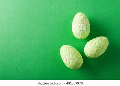 green easter egg on a green background