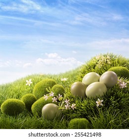 Green easter eggs on grass
