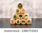 Green and eco building concept. wooden cubes with green building symbols on the natural background. LEED certification. Leadership in Energy and Environmental Design. Sustainable building.