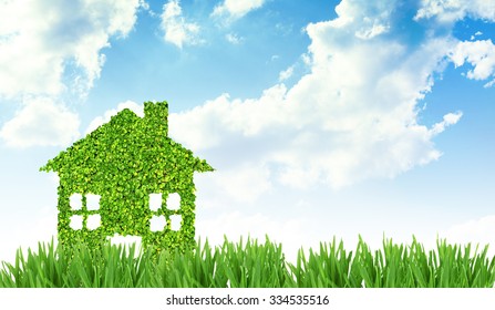 Green eco house on nature background - Shutterstock ID 334535516