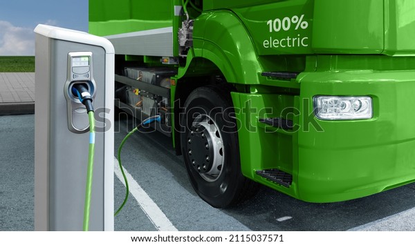 Green electric truck is charged from the charging\
station. Concept