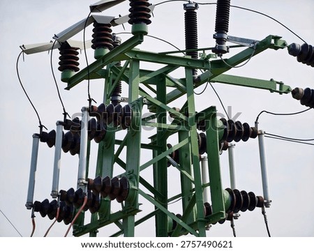 Green Electrical Tower With Insulators And Ceramic Discs, Closeup Of Highvoltage Transmission Structure