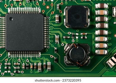Green electronic board with microprocessor. Microcircuit close-up