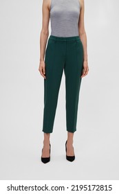 Green Emerald Women's Pants On Model Woman Isolated On White Background. Pleated Trousers For Female Ladies. Template, Mock Up