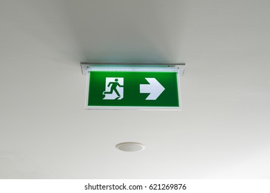 Green Emergency Exit Sign On White At A Hospital