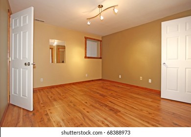 Green empty room without windows with two open inside doors.