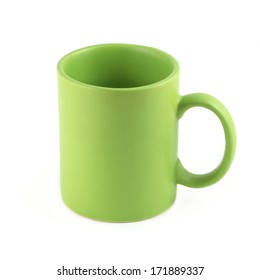 Green empty tea or coffee cup isolated on white closeup